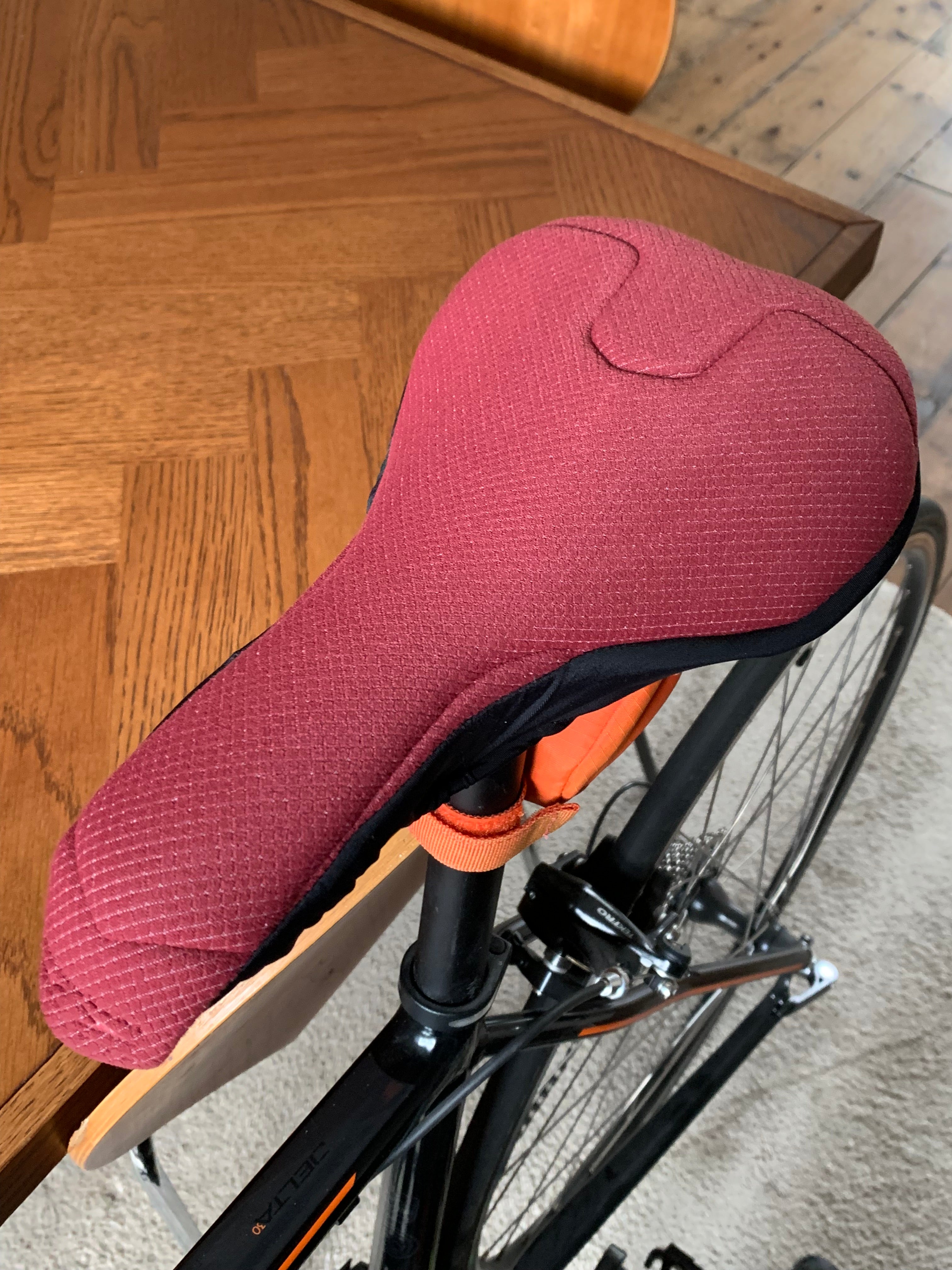 SPIN_Woman_Black_Ruby_Padded_Peloton_Bike_Seat_Cover_Endurance_Cycle_Training_by_Pedalshed